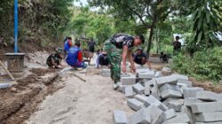 TMMD 129 Bangun Akses Jalan Depan Vihara Vimalakirti, Perkuat Kerukunan Warga