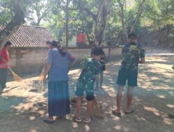 Satgas TMMD dan Murid Sekolah Minggu Bersih-Bersih Halaman Vihara Vimalakirti